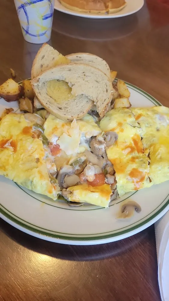 Steak and Cheese Omelette with Home Fries and Rye Toast